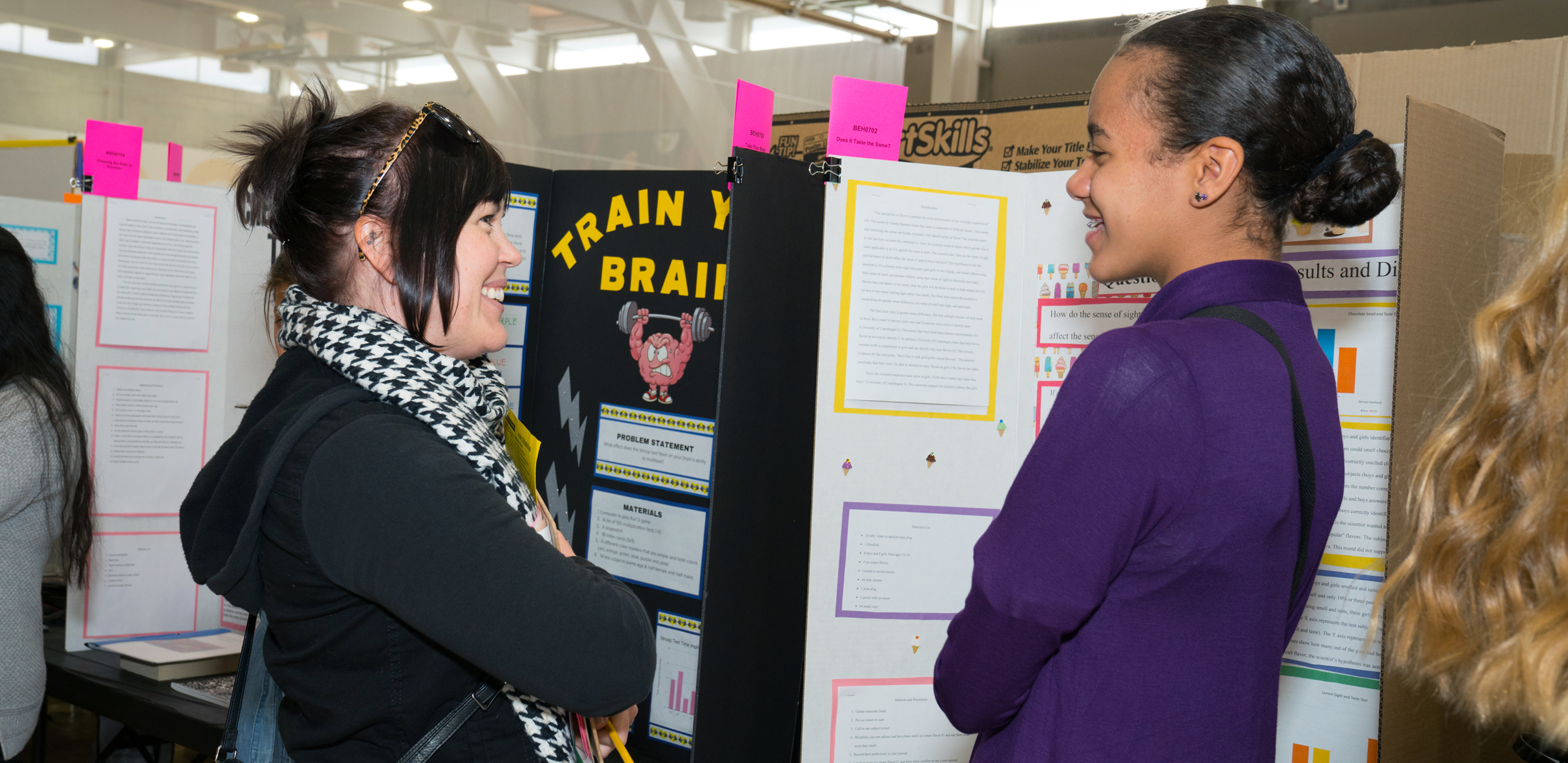 Woman and girl in front of display