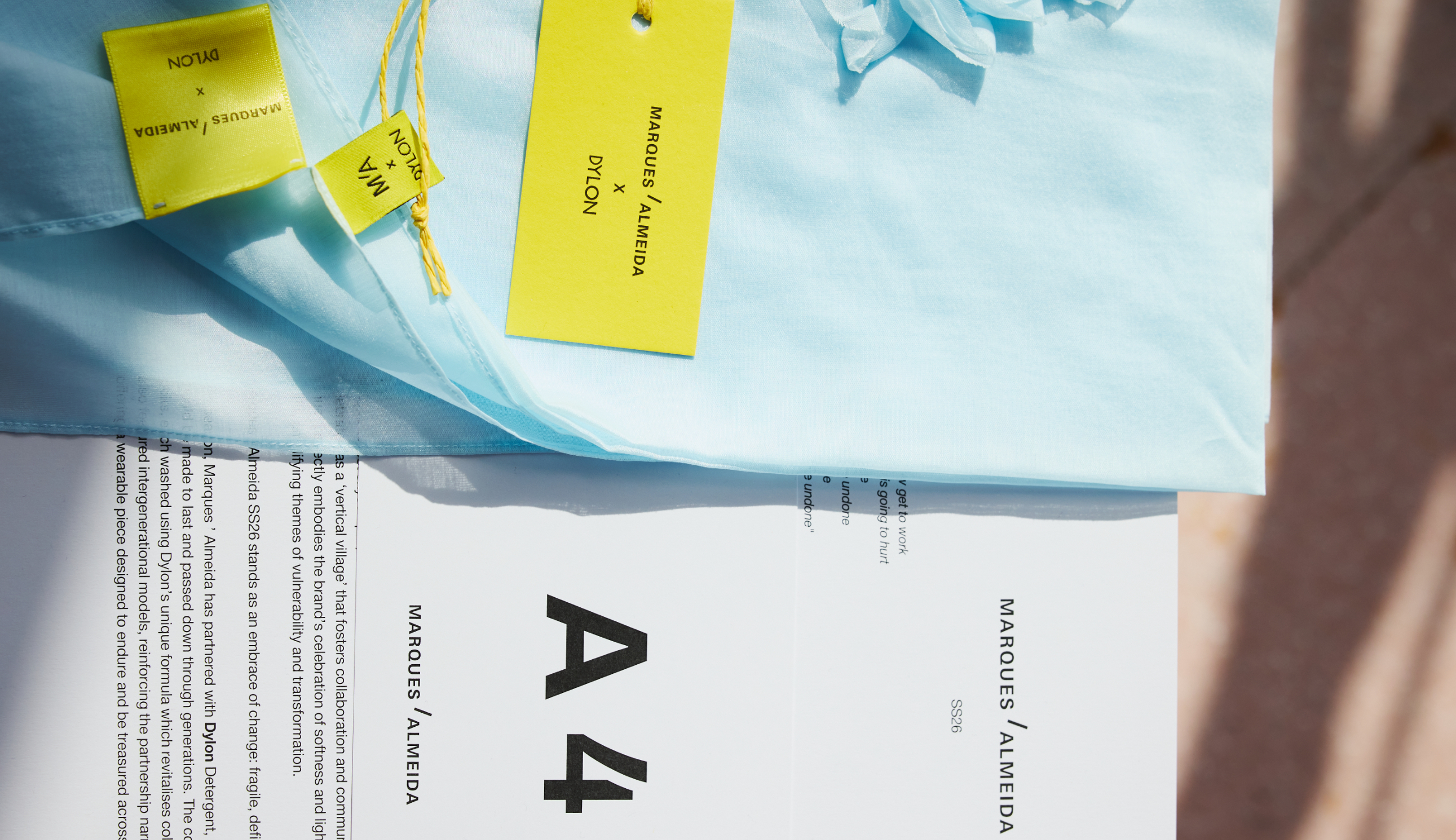Dylon x Marques Almeida tagged piece of clothing next to an information sheet