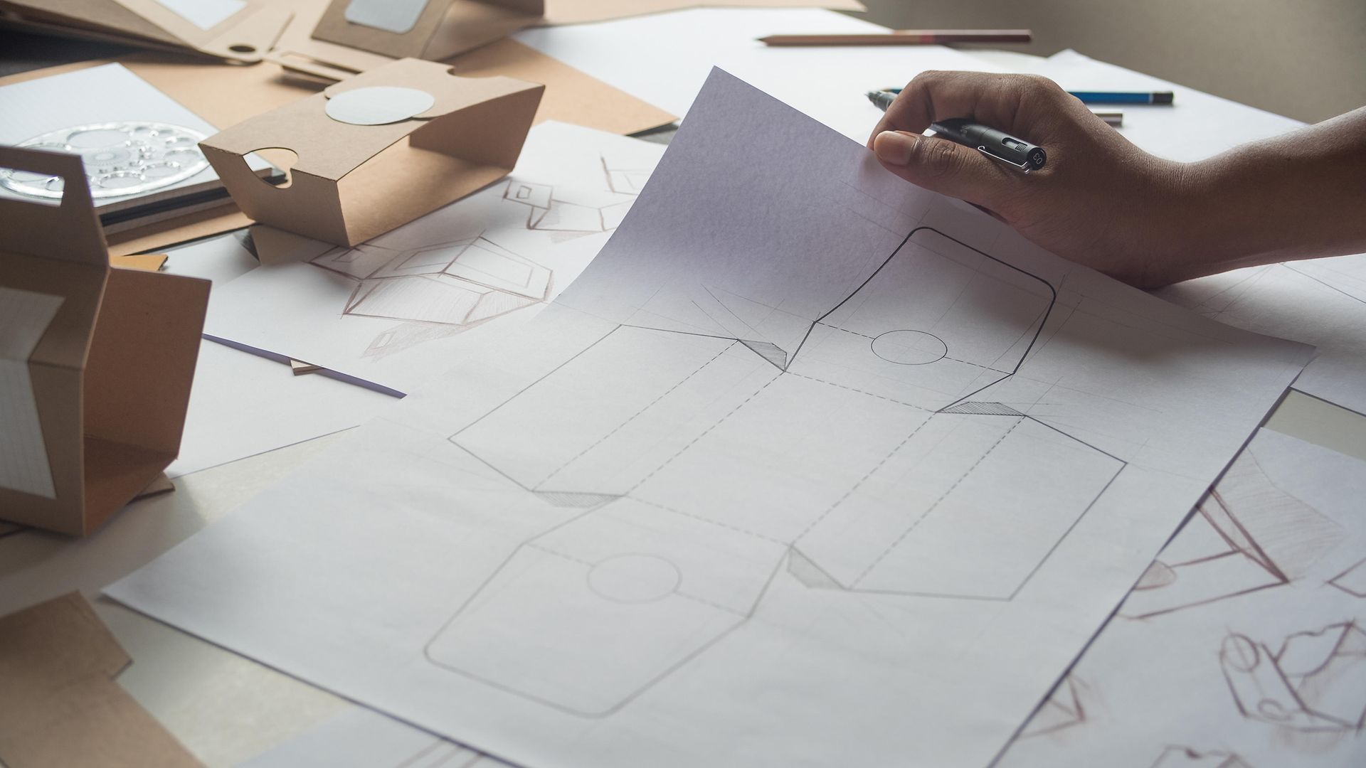 Designer draws a packaging template.