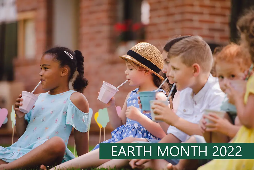 A group of children drinking from straws