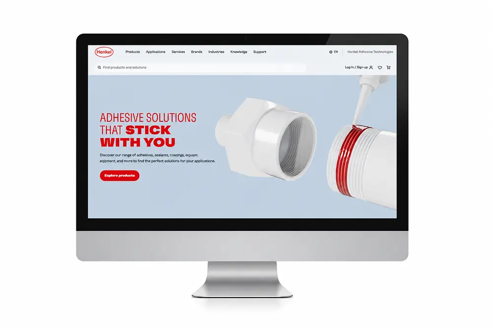 Monitor screen with the Adhesive Technologies website.
