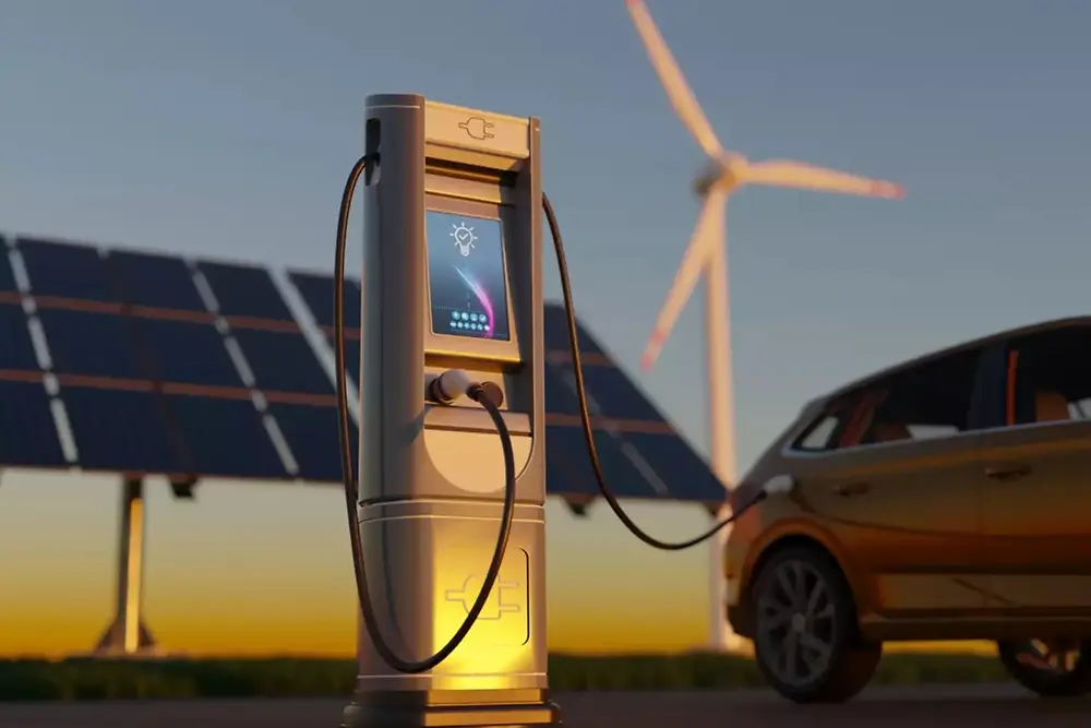 Electric vehicle charging station with solar panels and wind turbines in the background.