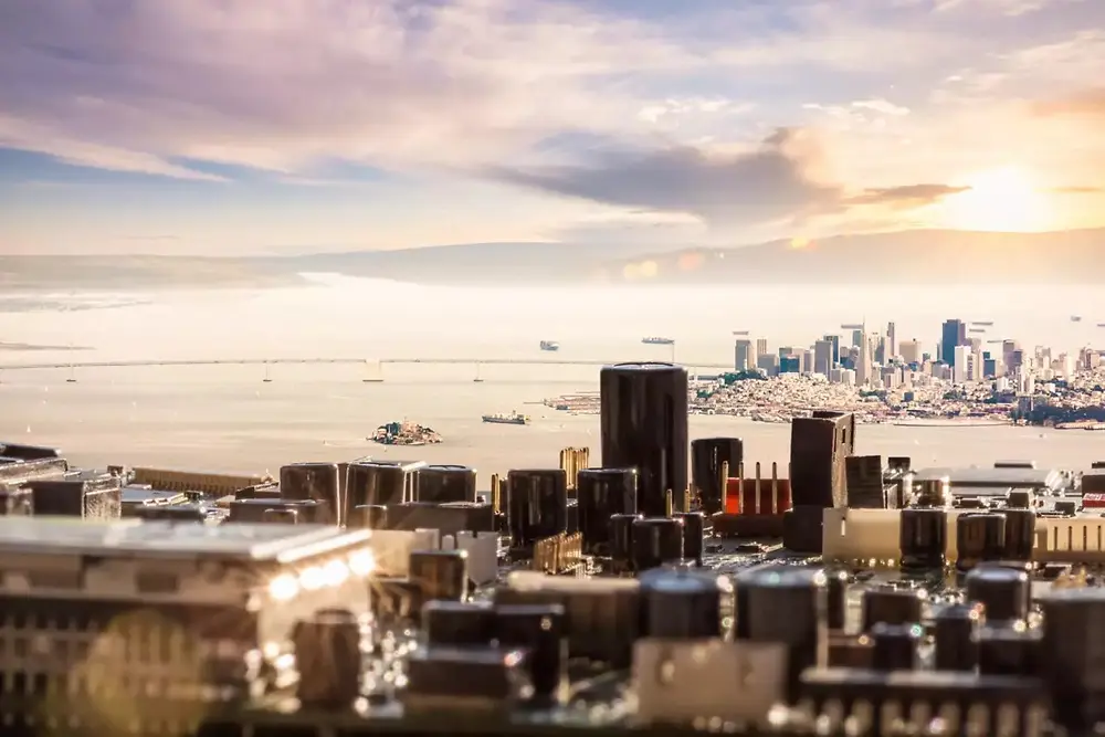 City skyline view with modern buildings under a sunset sky.