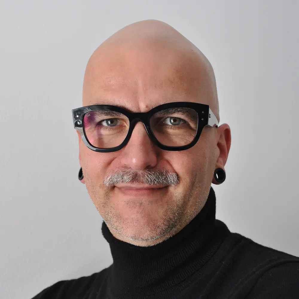 Portrait photo of Christian, showing him smiling at the camera.