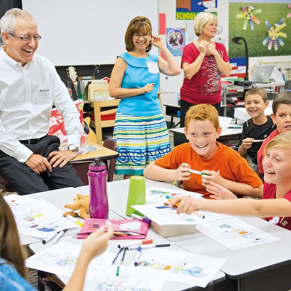 Norbert Koll, President of Henkel Consumer Goods Inc., meets with students at a school in Scottsdale, Arizona.