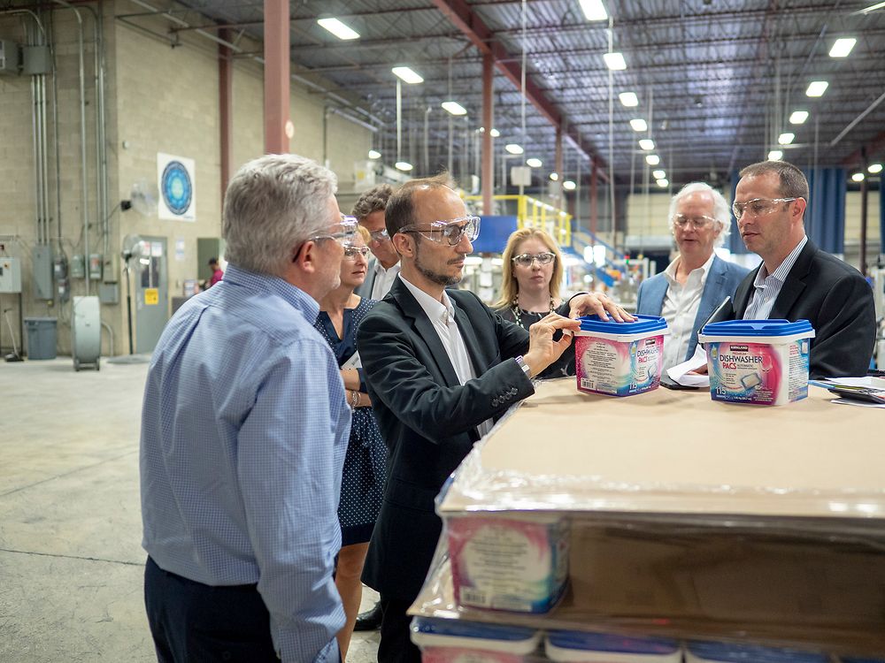 Bruno Piacenza inspects one of JemPak’s products during the Oakville plant tour. JemPak manufactures and distributes store-brand laundry and dish cleaning products for a range of retail stores.